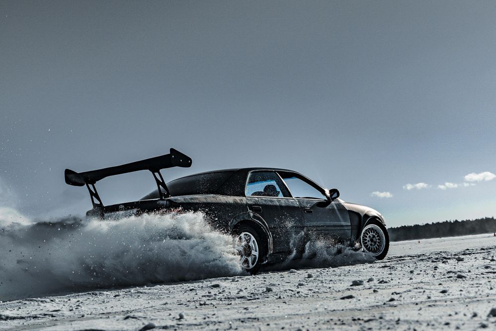 Car drifting across snow